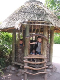 Kids enjoying an African  hut at the Seattle Zoo